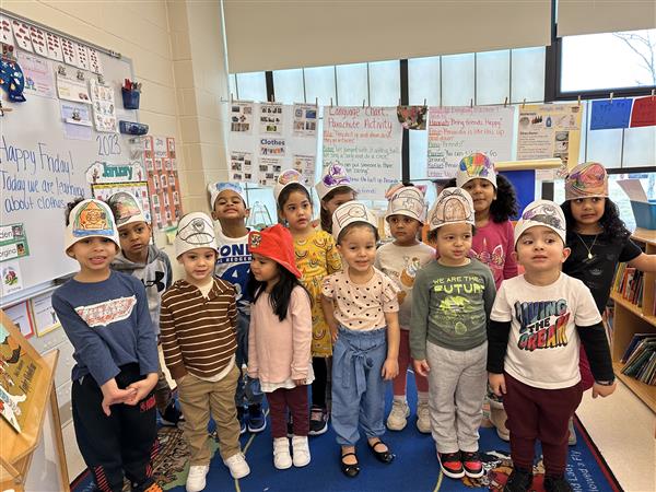 Students pose together on community helpers day