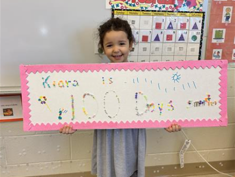 Students pose on the 100th day of school