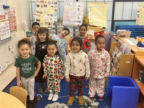 Students pose together on pajama day