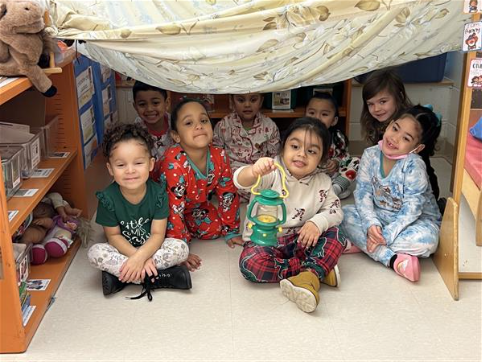 Students pose together on pajama day